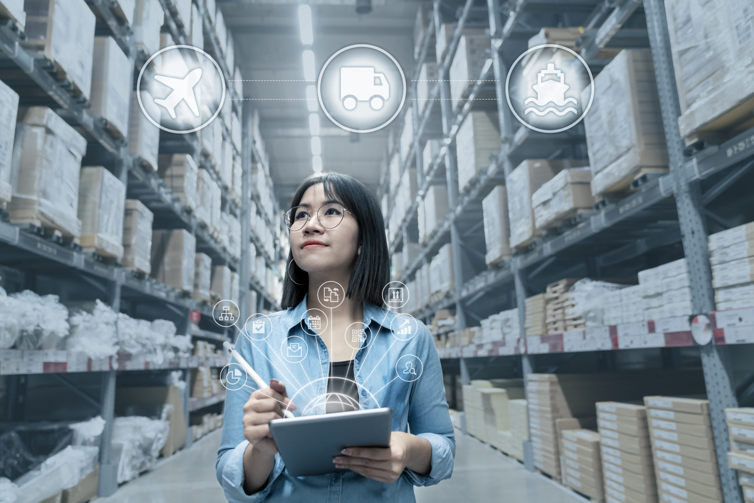 Portrait of young attractive asian entrepreneur woman looking at inventory in warehouse with smart tablet in management technology, international connected industry, asian small business sme concept.